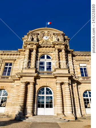 The grand classical facade of the Luxembourg Palace, home of the French Senate, in Paris, France under a clear blue sky. The grand classical facade of the Luxembourg Palace, home of the French Senate, in Paris, France under a clear blue sky. 143228880