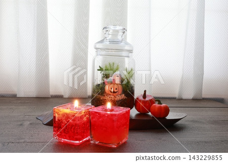 Orange candles create a Halloween theme. Orange candles create a Halloween theme. 143229855