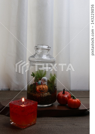 Orange candles create a Halloween theme. Orange candles create a Halloween theme. 143229856