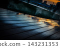 The wooden deck bathed in the sunset light 143231353
