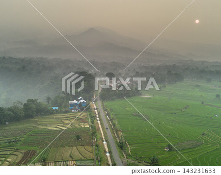 beauty morning light sunrise at paddy fields asia, Beautiful morning view in Indonesia, panoramic landscape of rice fields with mountain ranges and clear sky 143231633