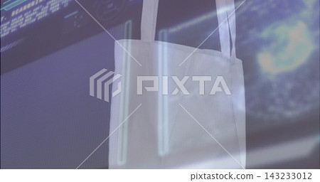 Hanging white fabric tote bag showing straps and texture in front of monitor, with neon reflections Hanging white fabric tote bag showing straps and texture in front of monitor, with neon reflections 143233012