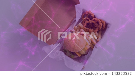 Displaying cardboard box with burger, fries, onion rings on light counter, purple-pink overlay Displaying cardboard box with burger, fries, onion rings on light counter, purple-pink overlay 143233582