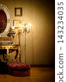 Vintage Ornate Interior With Gold Mirror, Candelabra Floor Lamp and Velvet Pouf by Console 143234035