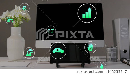 Displaying central desktop monitor and tablet showing green icons on clean desk, keyboard, vase Displaying central desktop monitor and tablet showing green icons on clean desk, keyboard, vase 143235547