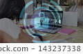 Showing laptop on wood table hosting grid call, featuring padlock HUD, student writing in sweater 143237338