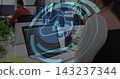 Displaying laptop projecting cloud-lock overlay on screen at open office, with red-shirt coworker 143237344