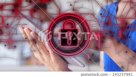 Holding slim tablet, two hands showing padlock and network graphics at office, blue sleeveless top Holding slim tablet, two hands showing padlock and network graphics at office, blue sleeveless top 143237991