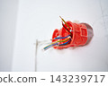 Electrical boxes with exposed wires installed in wall 143239717