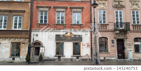 Facade of the historic Pod Samsonem restaurant in Warsaw, Poland, with decorative street lamp - Warsaw, Poland - January 26, 2023 Facade of the historic Pod Samsonem restaurant in Warsaw, Poland, with decorative street lamp - Warsaw, Poland - January 26, 2023 143240753