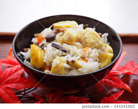 Chestnut rice and maple leaves served on a tray Chestnut rice and maple leaves served on a tray 143241003