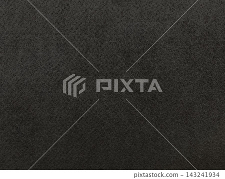A horizontal background image of a dark black-gray, coarse felt fiber surface. A horizontal background image of a dark black-gray, coarse felt fiber surface. 143241934