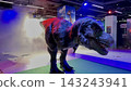 A Tyrannosaurus Rex waiting for food in a human's hand. 143243941