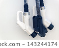 Detailed close up of new electric car charging plugs wrapped in protective plastic film with copy space 143244174