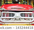 Close up front view of a vintage classic red passenger truck in Thailand. 143244418