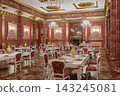 Opulent Red and Gold Luxury Dining Room in Grand Palace Banquet Hall With Chandeliers and Ornate Decor 143245081