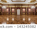 Grand Luxury Ballroom Interior With Ornate Gold Detailing, Marble Columns and Crystal Chandeliers in a Palace Hall 143245082