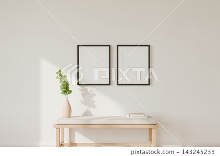 Two black frame mockups above a linen bench on a white wall 143245233