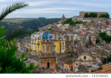 Panoramic view of the historic hillside town of Ragusa Ibla in Sicily under a cloudy sky Panoramic view of the historic hillside town of Ragusa Ibla in Sicily under a cloudy sky 143246092