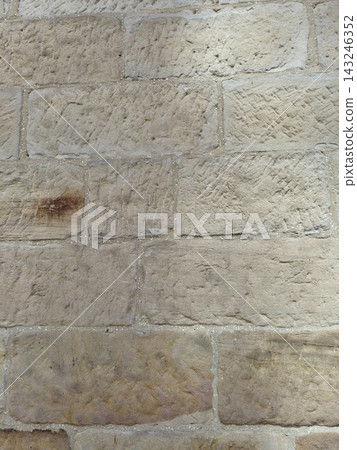 It is a brick wall made of sandstone. It is a brick wall made of sandstone. 143246352