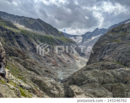 Glacial valley of Tre-La-Tete with rocky cliffs in Les Contamines-Montjoie, France Glacial valley of Tre-La-Tete with rocky cliffs in Les Contamines-Montjoie, France 143246762