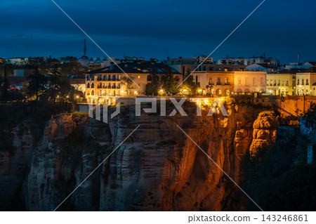 Illuminated buildings on the cliff edge of Ronda at blue hour Illuminated buildings on the cliff edge of Ronda at blue hour 143246861