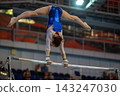 Female gymnast performing handstand split 143247030
