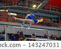 Female gymnast performing flight split 143247031