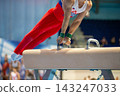 Male russian gymnast performing on pommel horse 143247033