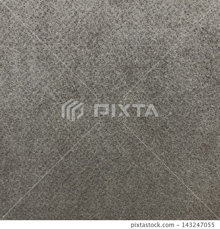 Square background image of a dark gray, rough felt fiber surface. Square background image of a dark gray, rough felt fiber surface. 143247055