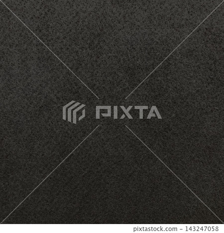 Square background image of a dark black-gray, rough felt fiber surface. Square background image of a dark black-gray, rough felt fiber surface. 143247058