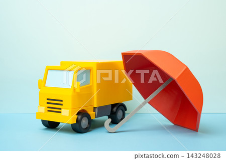 Truck and red insurance umbrella. Insurance for transportation and freight vehicles. Risk protection, cargo coverage, logistics security and business continuity. Truck and red insurance umbrella. Insurance for transportation and freight vehicles. Risk protection, cargo coverage, logistics security and business continuity. 143248028