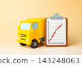 Truck and growth chart on paper tablet. Financial reporting, statistics and analytics. Logistics performance, revenue growth, freight demand and business data. Transportation market analysis. 143248063