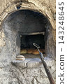 Traditional Bread Baking in Rustic Stone Oven. 143248645
