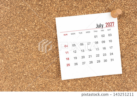 White calendar sheet for July 2027 with thumbtack on board, Position with copy space. White calendar sheet for July 2027 with thumbtack on board, Position with copy space. 143251211