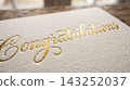 Extreme close up detail focusing on the luxurious texture of a gift card resting on a book cover 143252037
