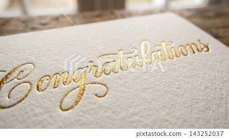 Extreme close up detail focusing on the luxurious texture of a gift card resting on a book cover Extreme close up detail focusing on the luxurious texture of a gift card resting on a book cover 143252037