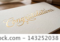 Extreme close up detail focusing on the luxurious texture of a gift card resting on a book cover 143252038