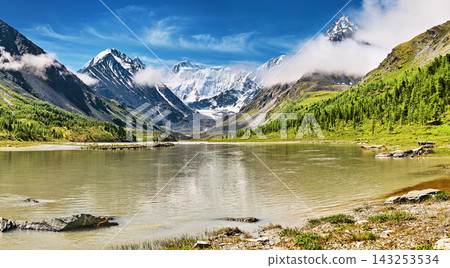 Mount Belukha the highest peak of Siberia part of the Katun range in Altai mountains and Akkem Lake on foreground Mount Belukha the highest peak of Siberia part of the Katun range in Altai mountains and Akkem Lake on foreground 143253534