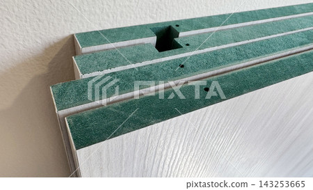 Stack of HMR (High Moisture Resistance) boards with melamine wood grain texture surface Stack of HMR (High Moisture Resistance) boards with melamine wood grain texture surface 143253665