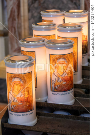 Votive candles with the icon of the Blessed Virgin of San Luca Votive candles with the icon of the Blessed Virgin of San Luca 143254404