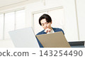 Japanese man thinking while facing a computer. 143254490