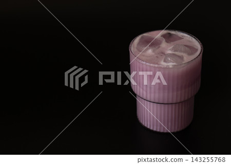 Pink Iced Matcha Drink in Glass on Dark Background Pink Iced Matcha Drink in Glass on Dark Background 143255768