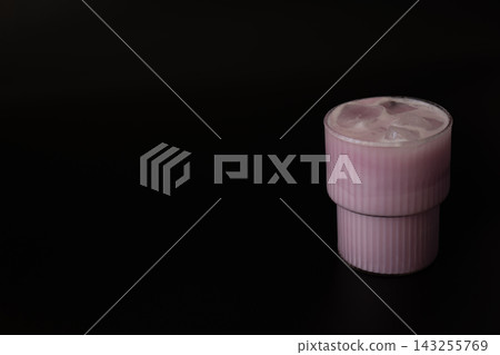 Pink Iced Matcha Drink With Ice Cubes on Dark Background Pink Iced Matcha Drink With Ice Cubes on Dark Background 143255769