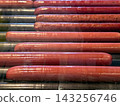 Delicious Sausages Rotating on a Roller Grill in a Vibrant Snack Area 143256746
