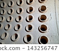 Industrial Tube Sheet Showcasing Holes for Heat Exchange Tubes in a Steam Boiler 143256747