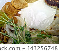 Delicious Varenyky Served With Sour Cream and Fresh Herbs in Vibrant Display 143256748