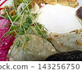 Delicious Varenyky Served With Flavorful Garnishes and Creamy Sour Cream 143256750