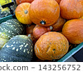 Bright and Colorful Pumpkin Varieties in a Lively Market Display 143256752