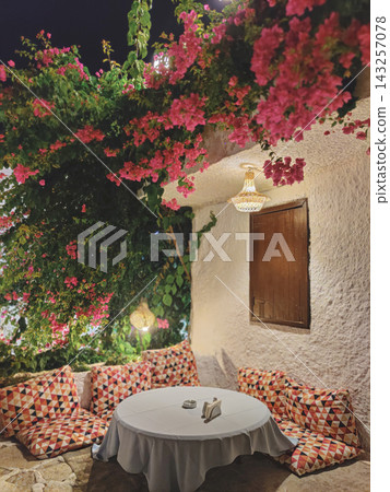 Night terrace in Kalkan with bougainvillea and geometric cushions Night terrace in Kalkan with bougainvillea and geometric cushions 143257078